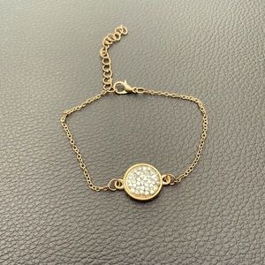 Copper colored steel with rhinestones in the circular shape